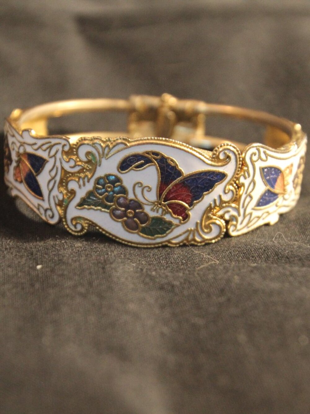 Bracelet, Cloisonne with butterflies. Gold tone, hinged. See description below.